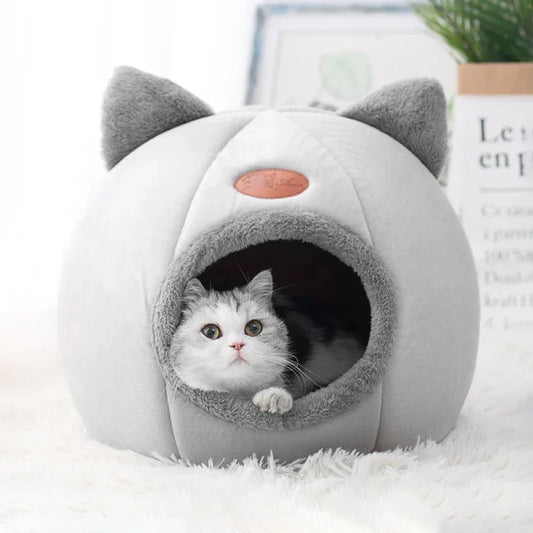 Cozy gray cat cave bed with cat ears, perfect for cats to snuggle and sleep comfortably.