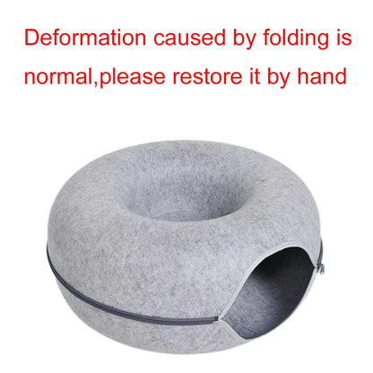 Gray felt donut-shaped pet bed with cozy cave entrance for cats and dogs