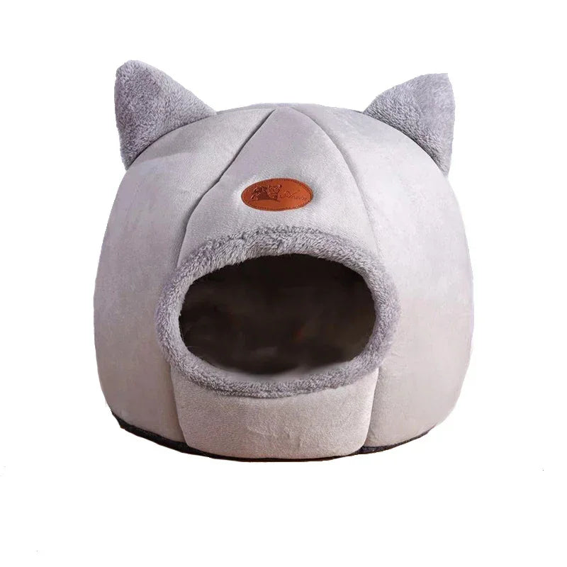 Cozy gray cat bed with plush ears and soft interior, perfect for cats and small dogs.