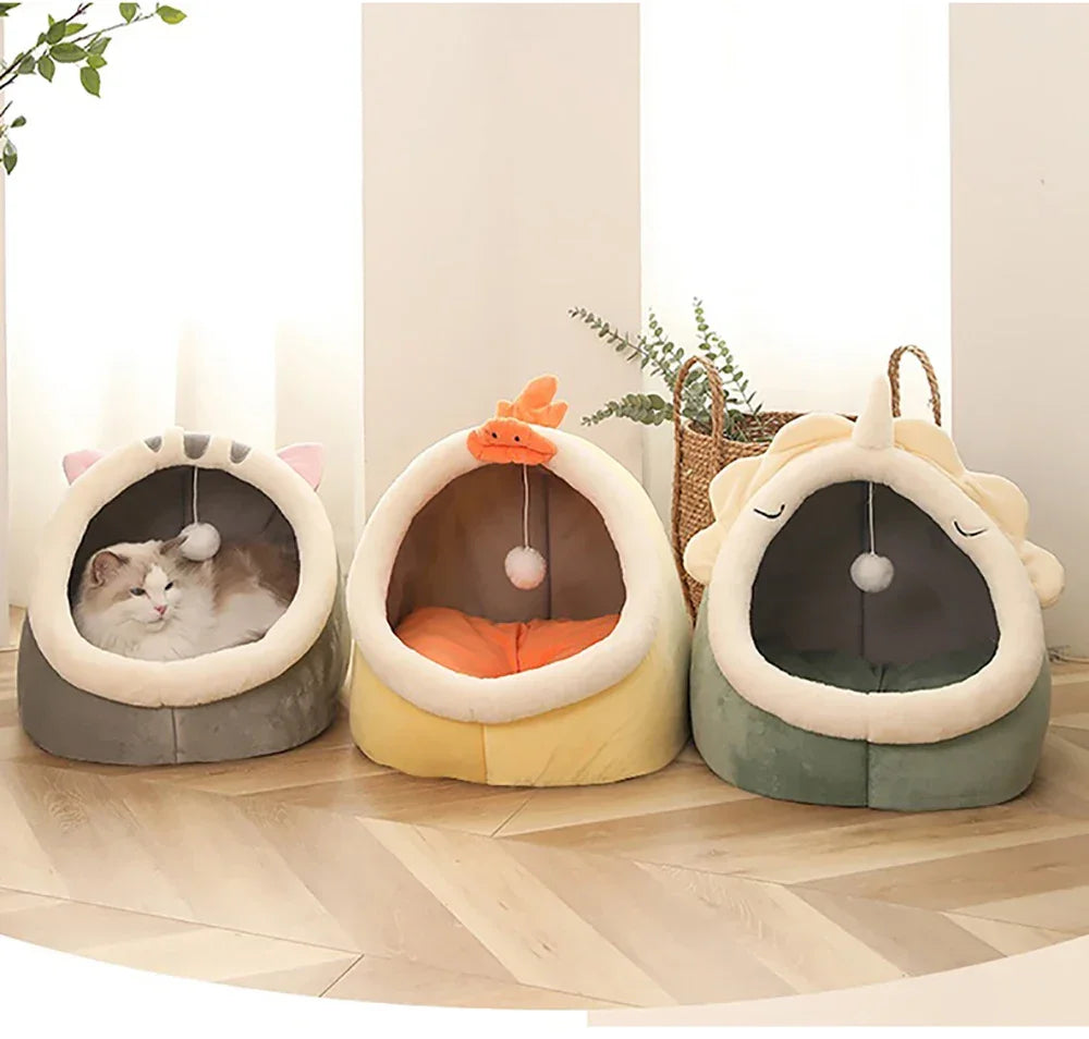 Cozy cat beds with playful designs, featuring a cat resting in a soft, enclosed pet bed with hanging toy.