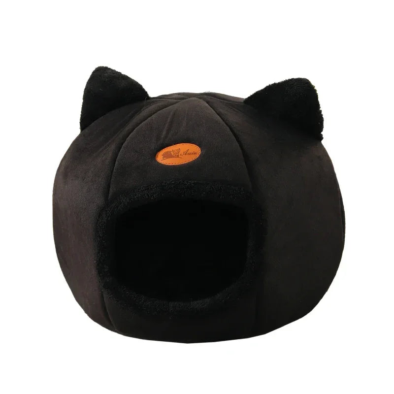 Cozy black cat bed with plush ears and soft interior, perfect for cats and small dogs.