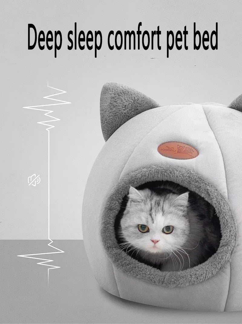 Cozy cat bed with soft gray plush, cat ears, and a snug cave design for deep sleep comfort.