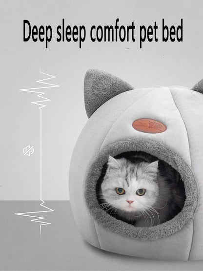 Cozy cat bed with soft gray plush, cat ears, and a snug cave design for deep sleep comfort.
